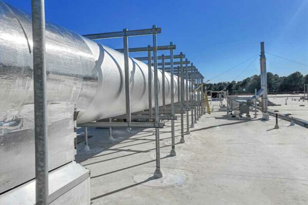 Rooftop pipe supports with stanchion attachment for wind and seismic