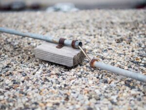 conduit on roof on wood block