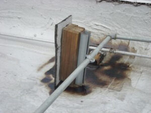diy conduit support for rooftop with wood block and strut