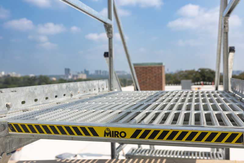 Rooftop stairs on roof overlooking Atlanta skyline